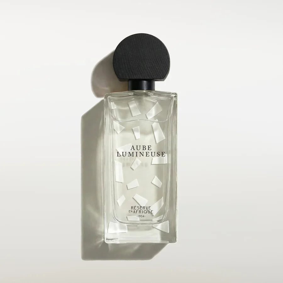 Flacon d'Aube Lumineuse, eau de parfum hespéridée boisée de Réserve en Afrique, parfumerie Rivora à Nancy